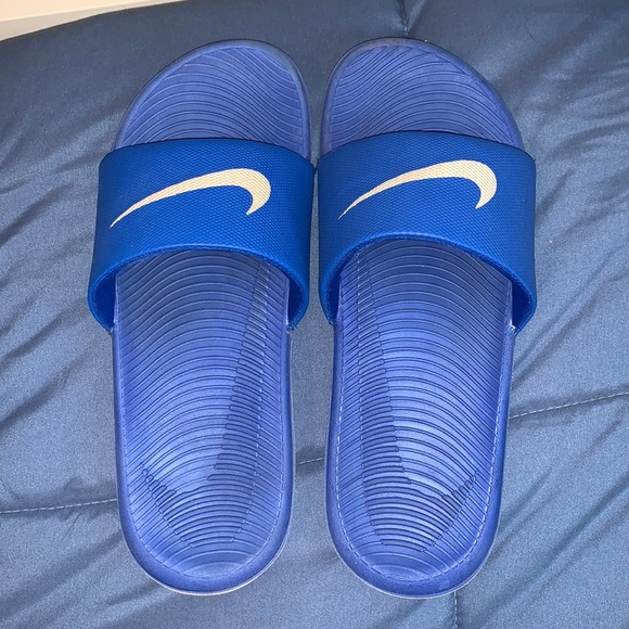 blue and white nike slides